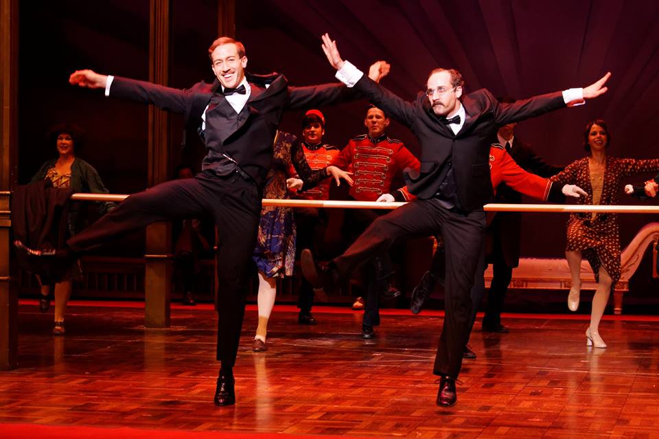 Christopher J. Deaton as The Baron, dancing with Andy Baldwin as Otto Kringelein